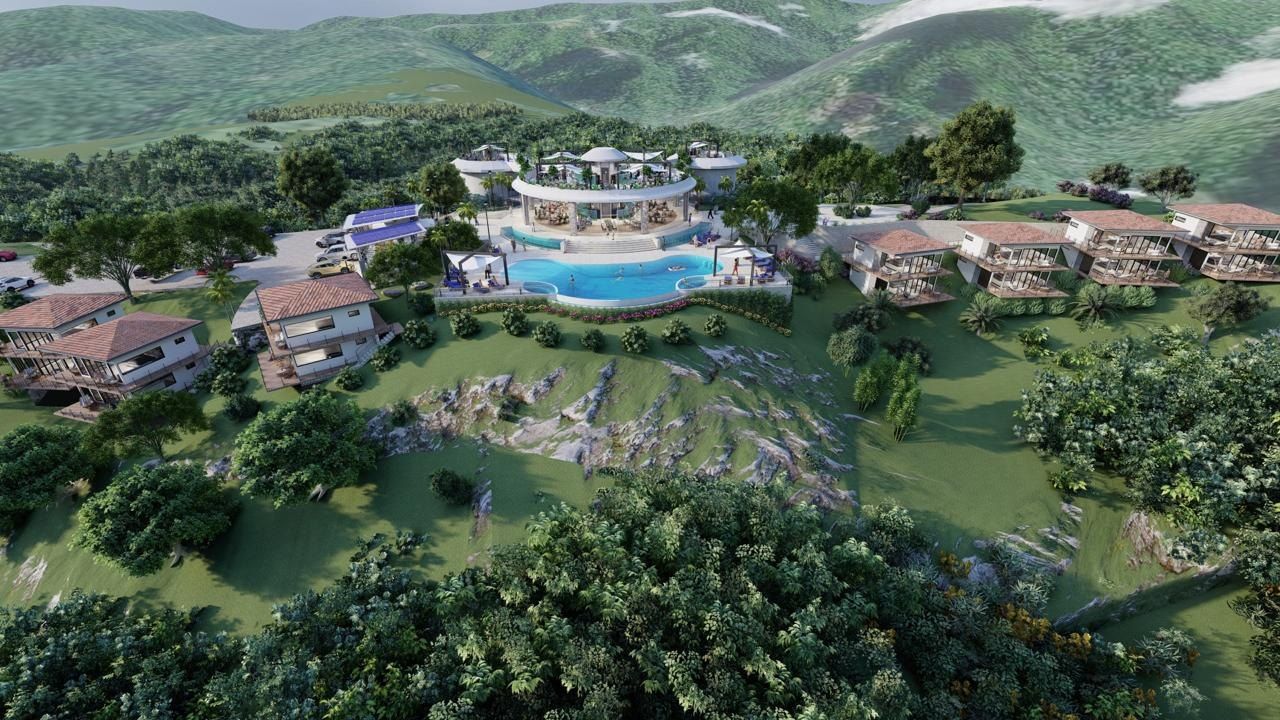 Vista aérea de un complejo hotelero integrado al bosque, diseñado por Grupo Trejos